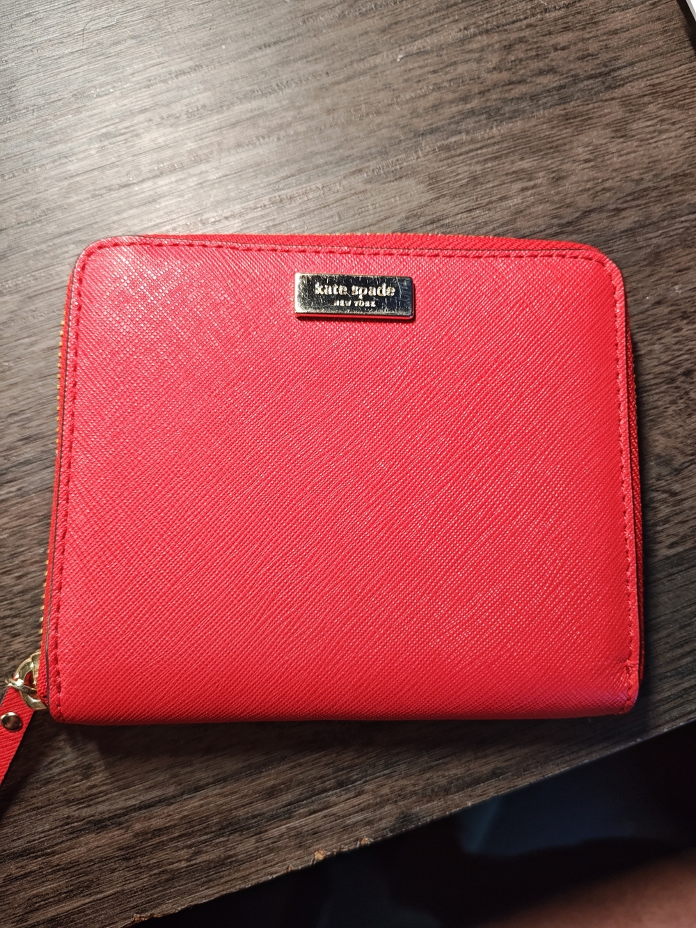 kate spade red zip-around wallet with gold plaque